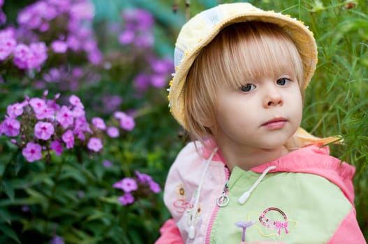 Little girl with flowers 2.5 years