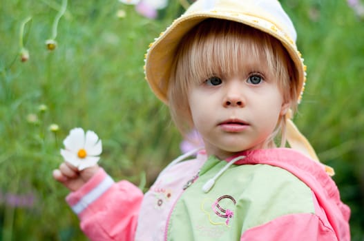 Little girl with flowers 2.5 years