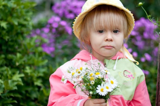 Little girl with flowers 2.5 years