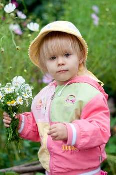 Little girl with flowers 2.5 years