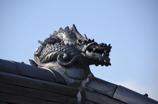 Brass dragon on the roof of a japanese temple
