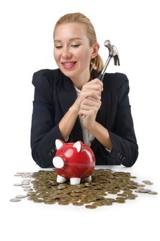 Woman breaking piggy bank for savings