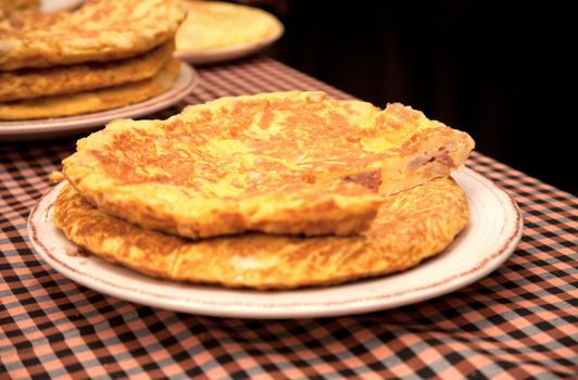 Fresh tortilla (omelet with eggs, potatoes, onion and ham), a typical Spanish food.