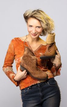 Woman carry cowboys boots