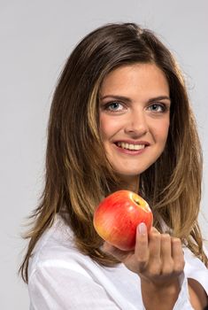 Woman with apple in man`s shirt