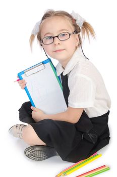 Little girl writing with pencils