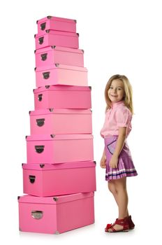 Little cute girl with lots of boxes