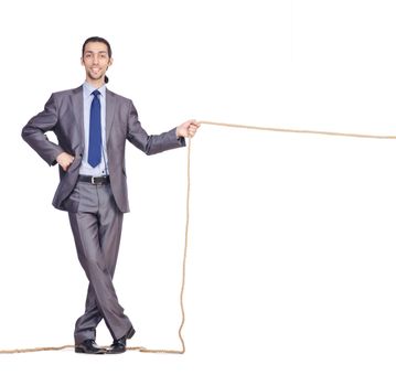 Businessman pulling rope on white