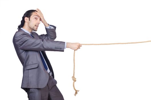 Businessman pulling rope on white