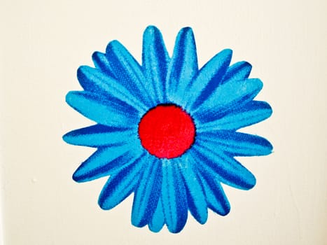 Blue flower painted on white wall