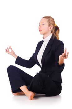 Young businesswoman meditating on the white
