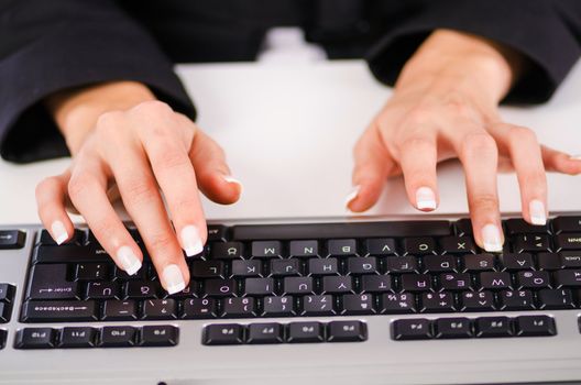 Hands working on the keyboard