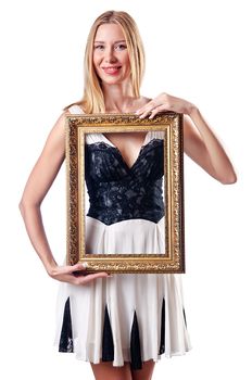 Young woman with picture frame on white