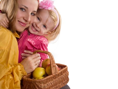 Mother and baby daughter with basket of apples isolated on white