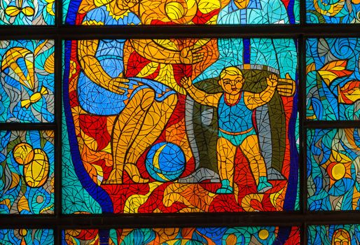 Old stained-glass window with people. Made in USSR