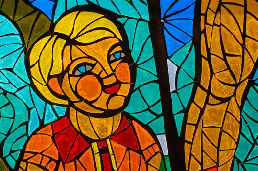 Old stained-glass window with people. Made in USSR