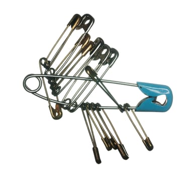 Macro image of many safety pins for clothes making on white background