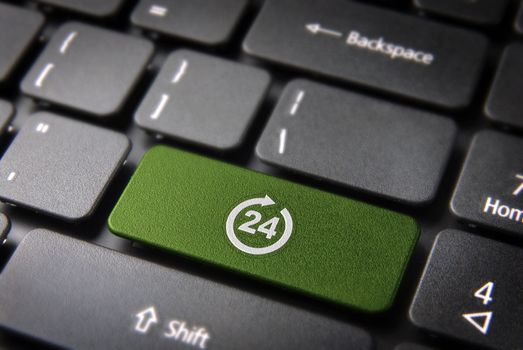 Online business always open concept: green key with 24 working hours symbol on laptop keyboard. Included clipping path, so you can easily edit it.