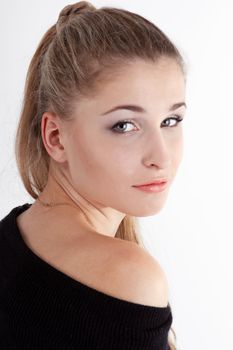 Portrait of blond long hair girl in blue  dress