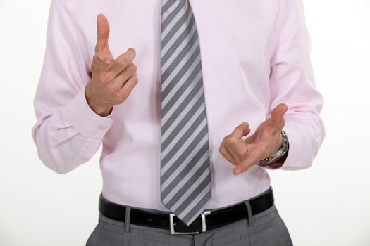 A businessman counting with his finger.