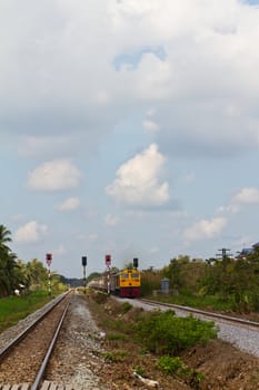 Thai train running on railroad