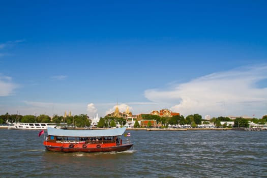 Chiness boat passing the gland palace in thailand