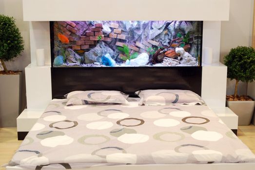 bedroom with aquarium over bed