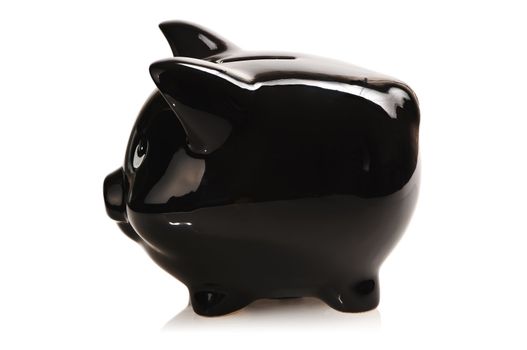 Black piggy bank isolated on white with soft reflection and shadow