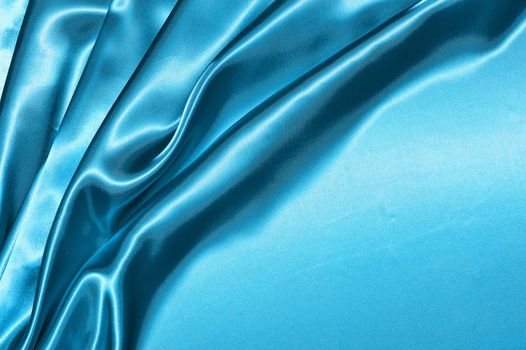 Beautiful folded blue silk background
