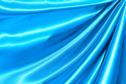 Beautiful folded blue silk background