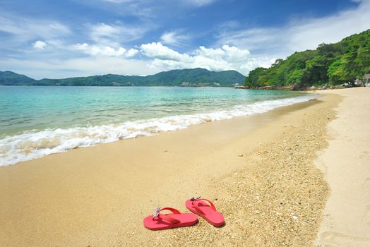 Beautiful beach landscape with flip-flops in Thailand