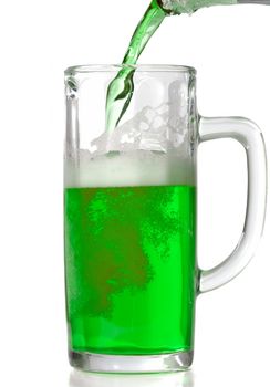 Green Beer mug isolated on white. Pouring green beer in it.