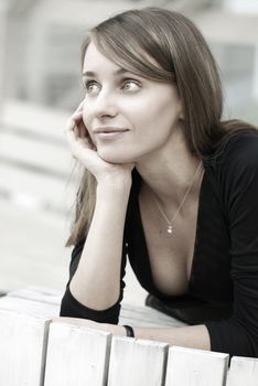 Young thoughtful girl outdoor portrait