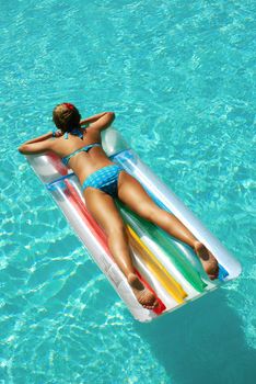 Girl in resort swimming pool