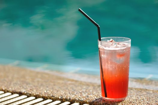Cocktail near the swimming pool, very shallow depth of field