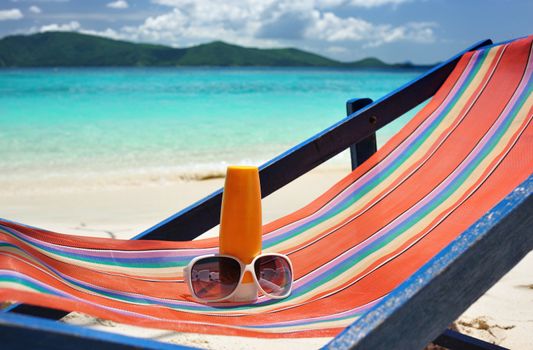 Sunscreen lotion on a beautiful beach 