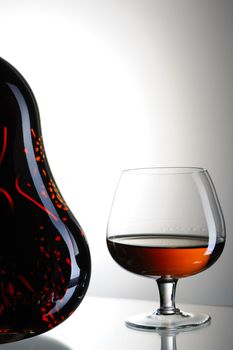 Cognac bottle and glass still life