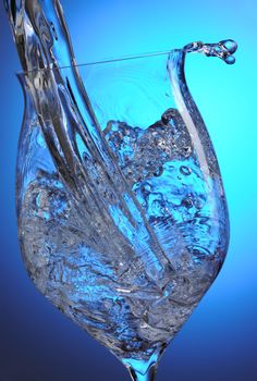 Splashing water into the glass