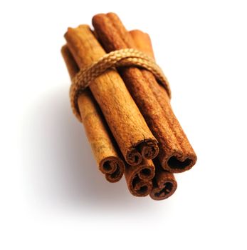 Cinnamon sticks over white background