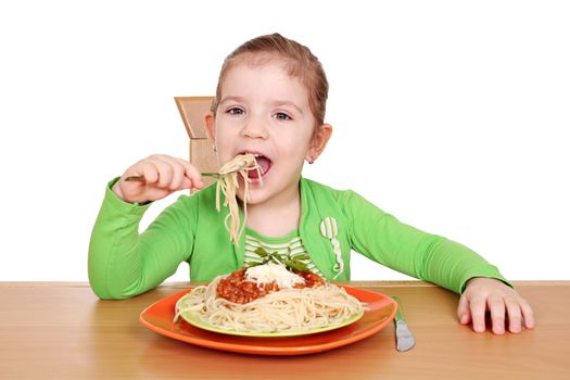 hungry little girl eating spaghetti