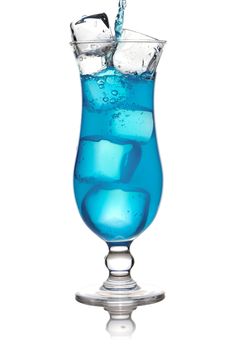 Pouring Blue Curacao cocktail in glass