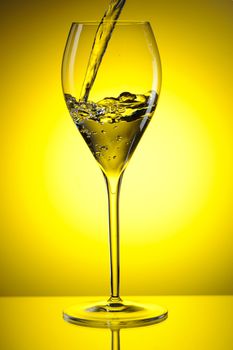 Pouring white wine into a glass