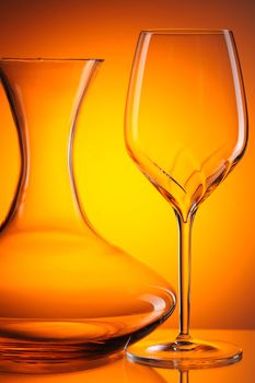 Glass still life over orange background