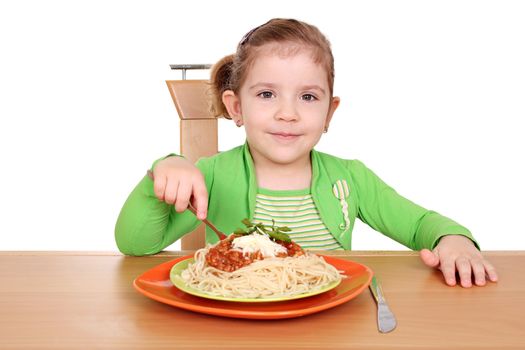 little girl eating spaghetti