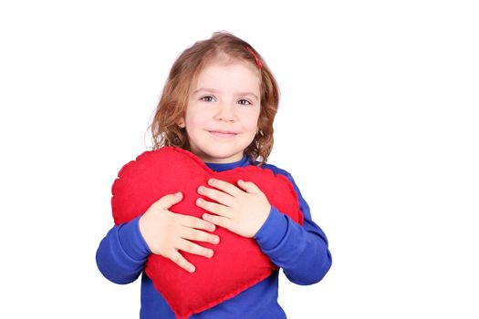 happy little girl holding red heart