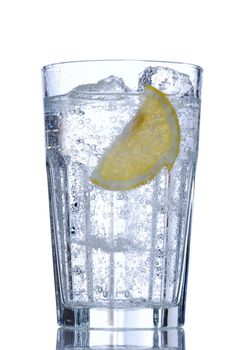 Water glass with ice & lemon isolated on white