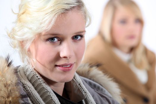 Two women in winter clothes.