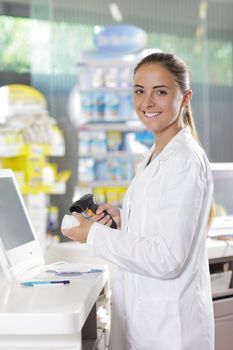 Portrait of a smiling female pharmacist at pharmacy