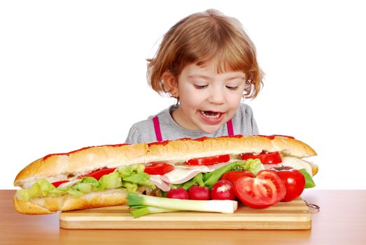 hungry little girl tries to eat big sandwich