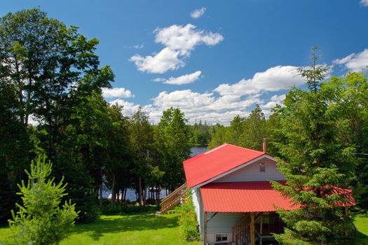 Inexpensive cottage on the lake in summer